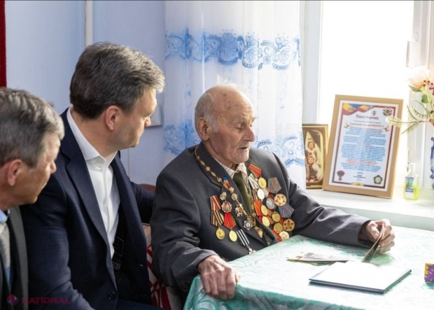 Veteran al celui de-al Doilea Război Mondial în vârstă de 100 de ani, vizitat de premierul Dorin Recean: ,,Datoria noastră este să păstrăm pacea pentru care bunicii și străbunicii noștri au luptat