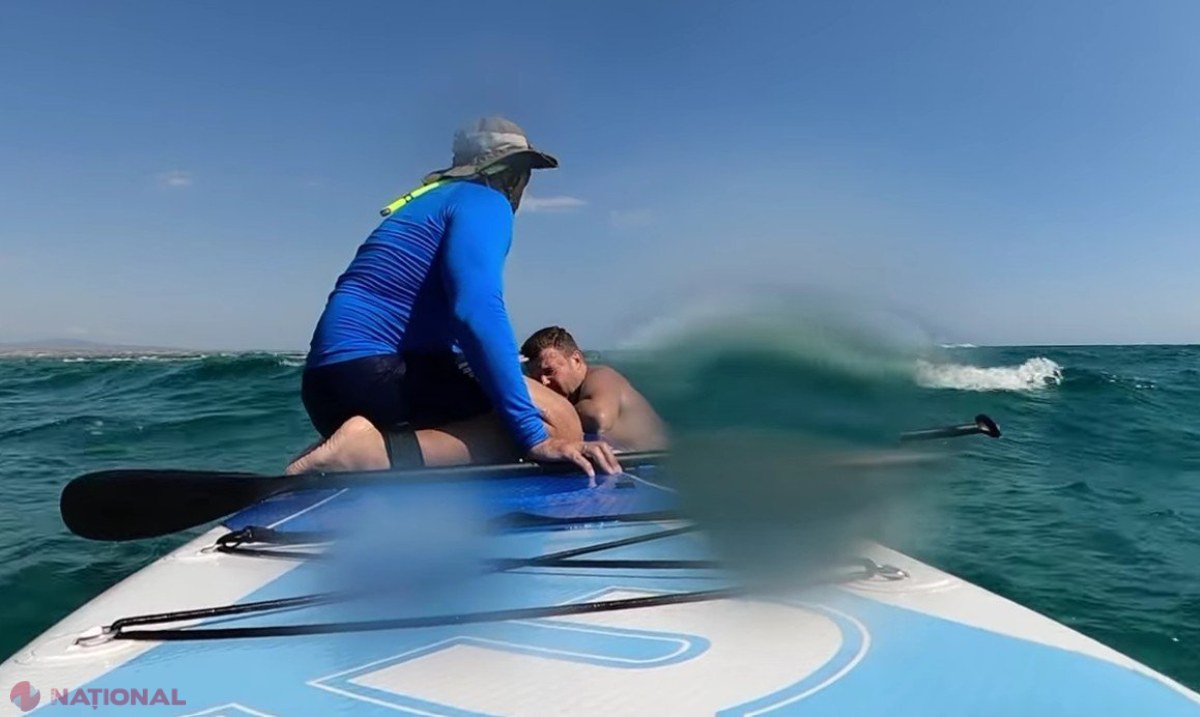 Un tată român și copiii săi salvați de la înec pe o plajă din Grecia de un surfer pe stand up paddle - Imaginile dramatice au devenit virale