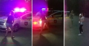 VIDEO // Imagini SCANDALOASE cu implicarea unei mașini de POLIȚIE din R. Moldova. Două tinere au fost surprinse în timp ce dansează LASCIV sub lumina GIROFARULUI. Una dintre aceasta avea o sticlă de alcool în mână