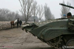 Ucraina: Doi civili UCIŞI după intrarea în vigoare a armistițiului în estul țării