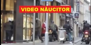 VIDEO // O femeie pune pe fugă un grup de infractori care spărgeau vitrina unui magazin de LUX