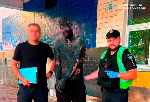 Hoț „invizibil” la Kiev: s-a uns cu smoală din cap până-n picioare ca să jefuiască un magazin și a fost curățat de polițiști în 5 ore