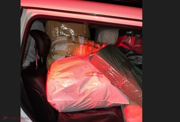 VIDEO // Mașini de lux, ticsite cu marfă de contrabandă. Hainele cu inscripția unor branduri de renume urmau să fie comercializate în piețele din Chișinău. Un șofer a încercat să FUGĂ de organele de drept, dar a nimerit într-un accident rutier