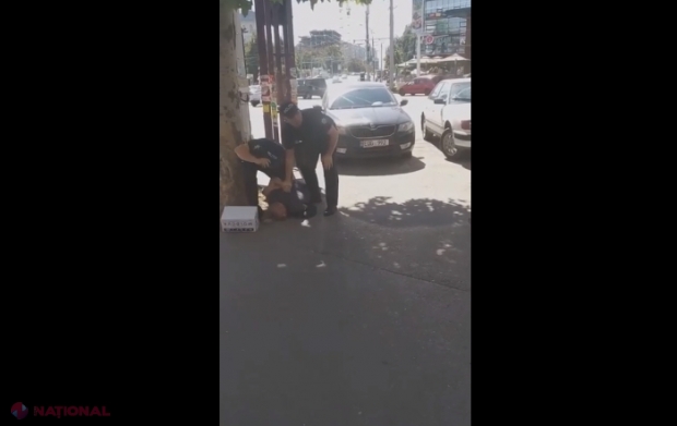 VIDEO // Bărbatul luat pe sus de polițiști, în timp ce vindea miez de nucă pe o stradă din Chișinău alături de soția și copilul său, riscă o amendă de câteva MII de lei 